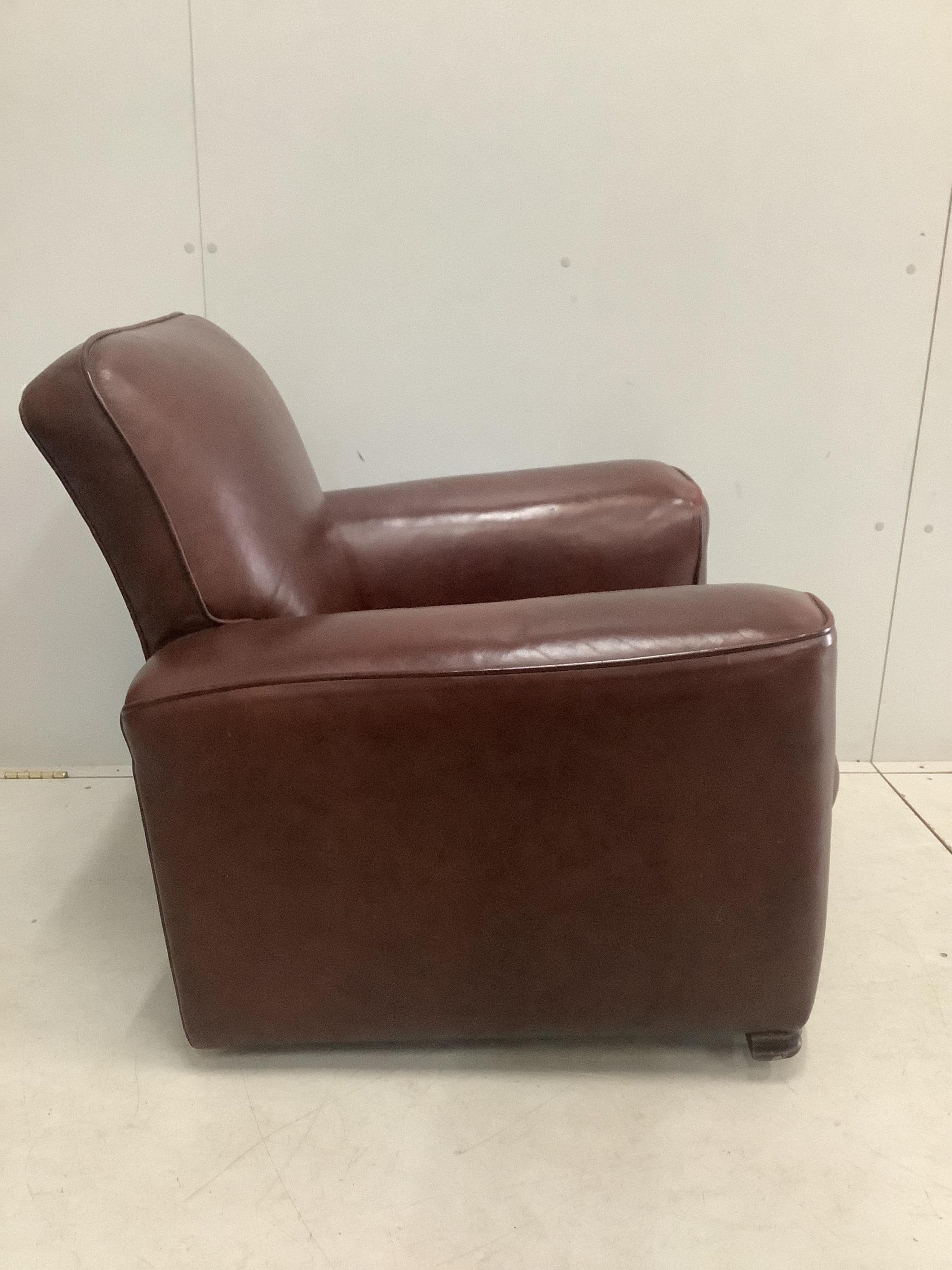 A 1930's brown leather club armchair, width 92cm, depth 75cm, height 80cm